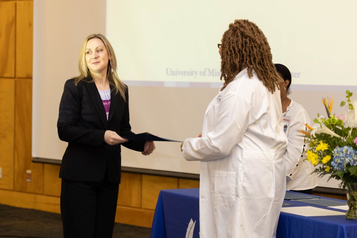 Student accepting an award at the 2023 Honors and Awards Ceremony